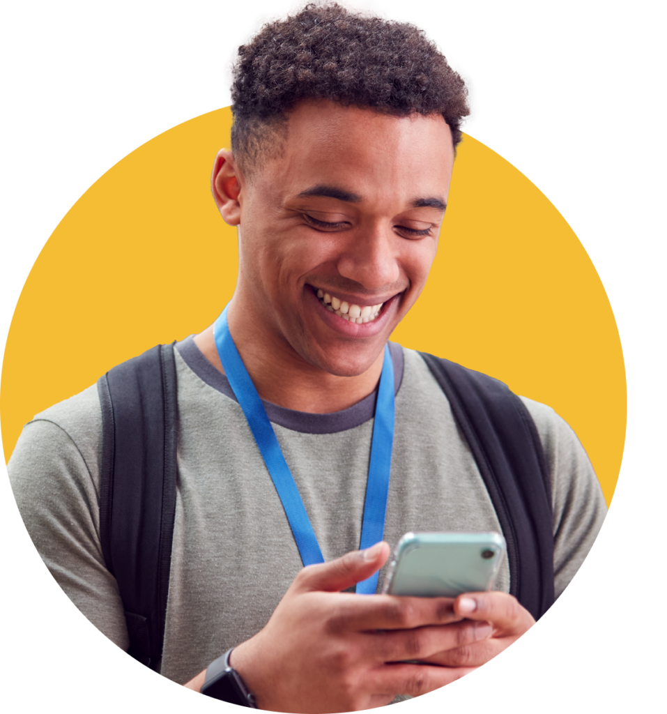 Smiling teenage boy wearing a backpack and lanyard, looking down at his smartphone. He appears engaged and happy, suggesting positive interaction with a wellness app. The background features a yellow semicircle, giving the image a bright and uplifting tone. This image represents youth benefiting from digital wellness tools and local mental health support provided by Insite Health NJ